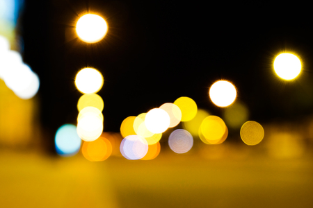 Night city street lights bokeh colorful background, the concept of darkness. City night lightsの写真素材