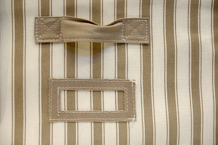 Roll towels with wicker basket on a shelf in the background stand. Bathroom interior design.