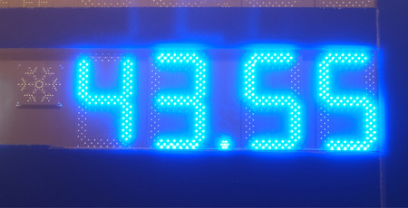 The neon blue numbers on the electronic scoreboard. Luminescent glow.