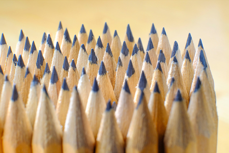 A pack of pencils, a sharpened gray rod. Top view, light from the window.の写真素材