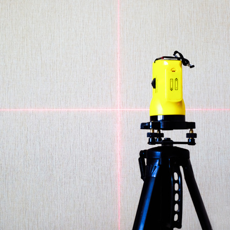 Construction of the laser level. Laser level measurement for construction work, shallow depth of fieldの写真素材