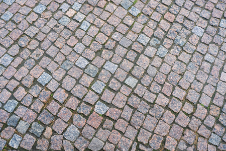 Ancient granite paving. Close-up view from above. Pavementの写真素材