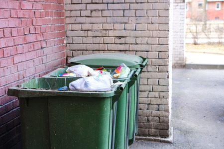 Garbage container. Filled to the brim. Environmental pollution. Ecological pollution. Problem of ecologyの写真素材