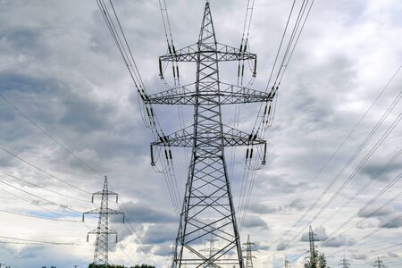 High-voltage power lines. Cloudy sky before a thunderstorm
