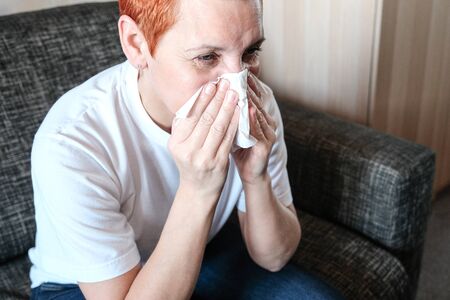 Portrait of colds. Medical symptom. Medical care. Symptom of allergy. Sore throat. Sick woman. Health Facialの写真素材