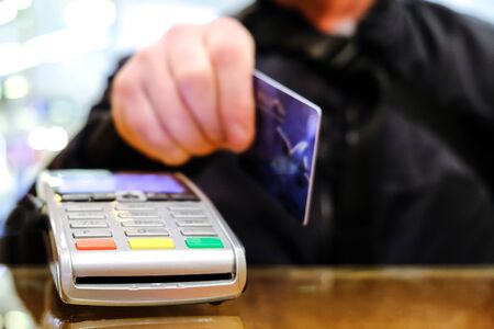 Buying groceries in a hypermarket. Credit card paymentの写真素材