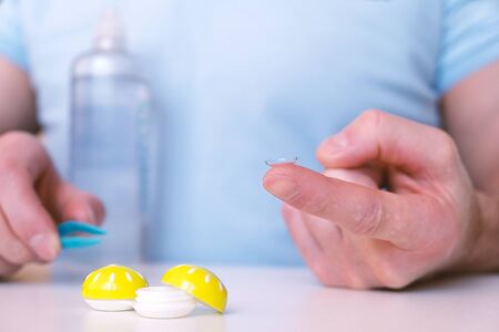 Lens on the tip of your finger. Ready for useの写真素材