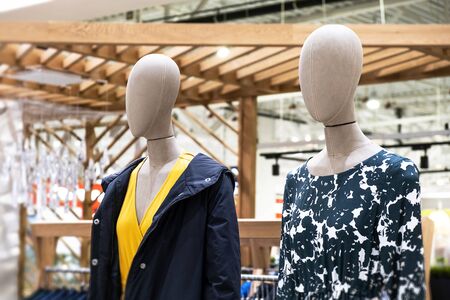 Boutique in the shopping center. Two mannequins. Storefront. Saleの写真素材