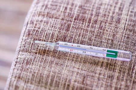 Thermometer after checking the body temperature.