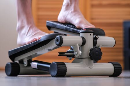 Leg training. The feet of the feet press on the pedals of the rehabilitation simulator. Recovery of the ankle joint after injuryの写真素材