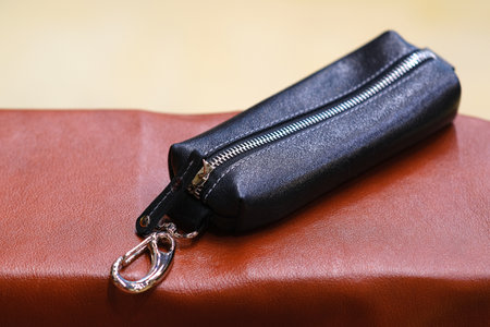 The housekeeper is made of genuine leather. The concept of stylish leather products. Bags, purses, and belts.の写真素材