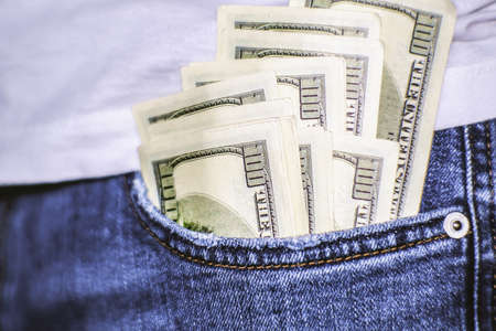 A wad of hundred-dollar bills sticks out of my pocket. A well-paid job