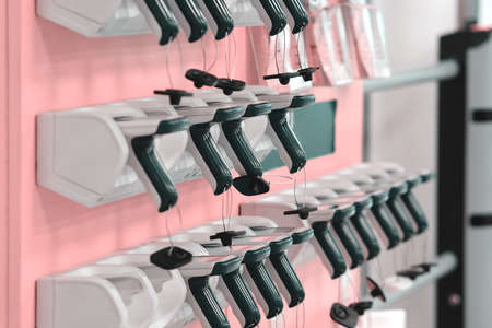 Portable handheld scanner for forming a basket of goods in hypermarkets and supermarkets. The concept of contactless shopping. Pandemic shopping. Grocery shopping.の写真素材