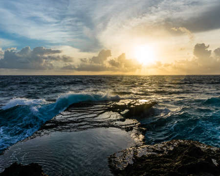Big waves breaking and splashing on the rocks. Devil's Tear, Nusa Lembongan, Indonesia
