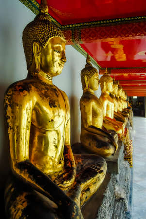 Row of Buddha statues in the Grand Palace, Bangkok, Thailandの写真素材