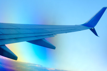 airplane wing at sunsetの写真素材