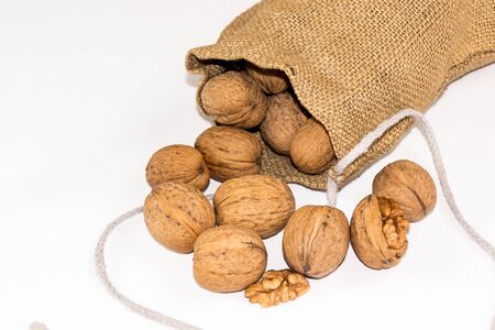 Walnuts isolated on a white background in a pouchの写真素材