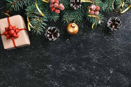Festive Christmas or New Year background. Xmas chalkboard framed with Christmas tree branches and...
