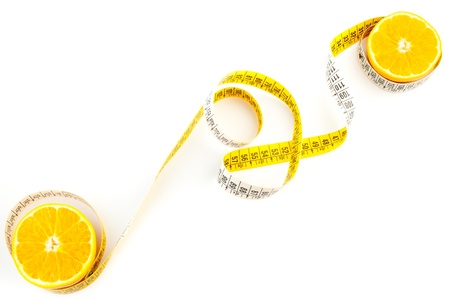 top view of the an orange with a measuring tape on white background