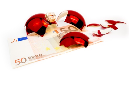 detail of banknotes of euro and broken ball on white backgroundの写真素材