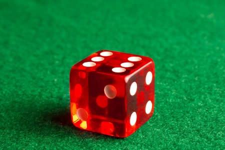 detail of one dice on gaming tableの写真素材