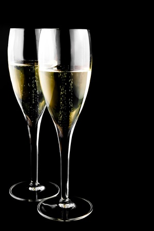 two glass with champagne on a black backgroundの写真素材