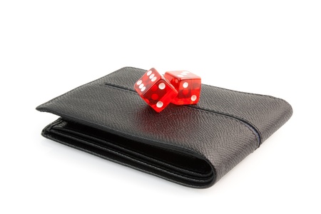 red dice on the leather wallet on white backgroundの写真素材
