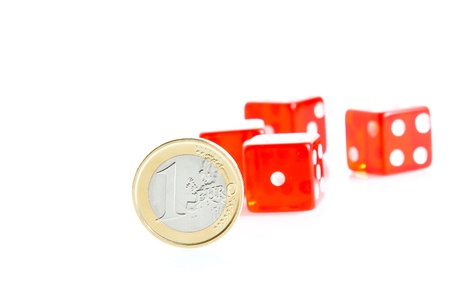 crisis, euro coins and red dice on background の写真素材