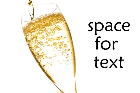 champagne flute with golden fine bubbles on white backgroundの写真素材