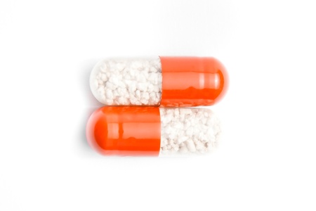 two medical pills isolated on white background