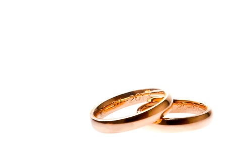 detail of gold wedding with space for text on white background