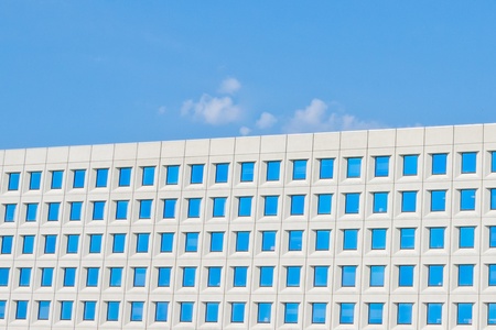 modern office building under blue skyの写真素材