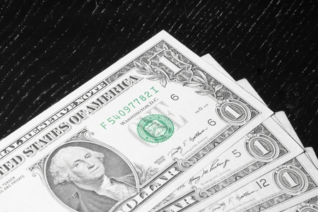 detail of usa dollars on wood table