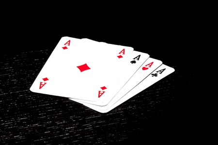 top of view of a winning poker hand on black wood table