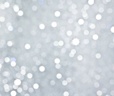 Abstract silver circular bokeh background of christmas lightの写真素材