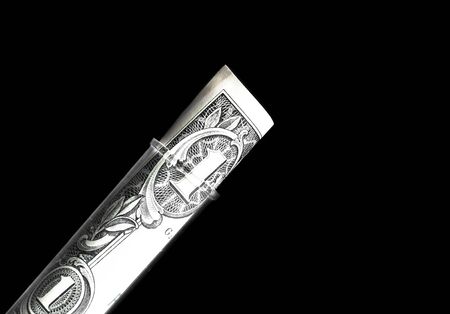 dollars in test tube, cost of medical health care on black backgroundの写真素材