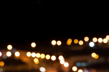city lights blurred bokeh background, night city lights with space for textの写真素材