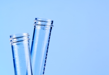 detail of the test tubes in laboratory on blue light tint background