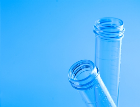 detail of the test tubes in laboratory on blue light tint background with space for text