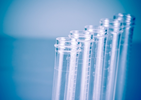detail of the test tubes in laboratory on blue light tint background