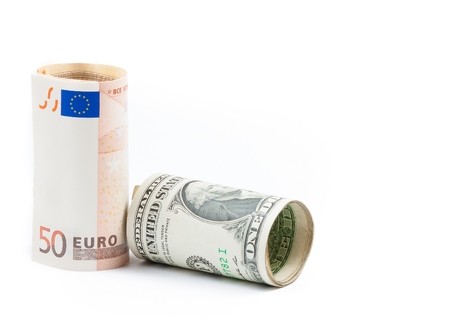 rolled up euro and rolled up dollars banknote on white background with space for text, concept for business and save moneyの写真素材