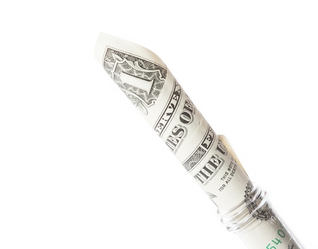 dollar banknote in graduated test tube, the cost of medical health on a white background with space for textの写真素材
