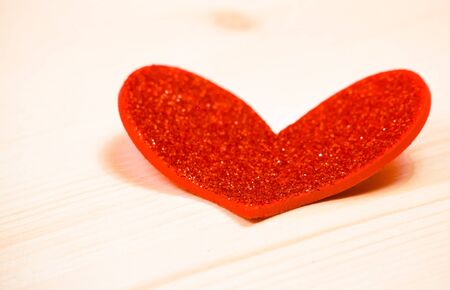 one decorative red heart on wood background with space for text, concept of valentine dayの写真素材