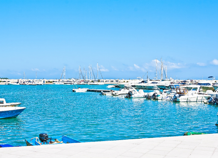 sea port with boats in the sunny day in Vieste Italyのeditorial素材