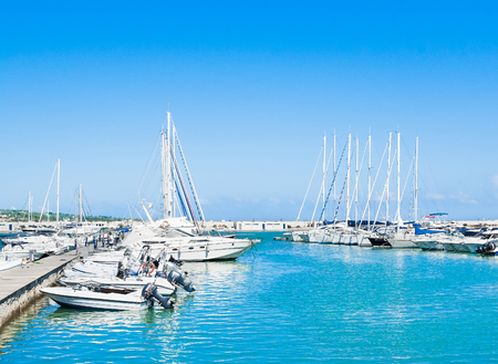 sea port with boats in the beautiful sunny day in Vieste Italyのeditorial素材