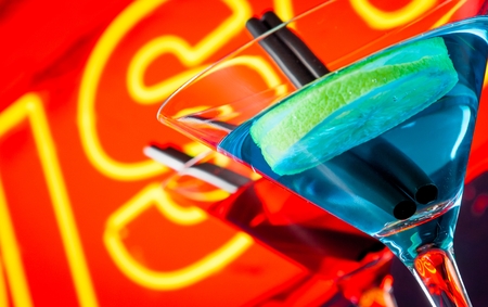 detail of cocktail with neon disco word background with space for text, dance disco atmosphereの写真素材