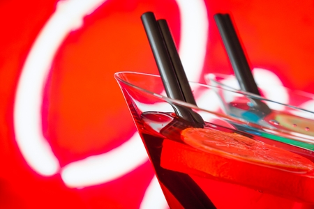 detail of red cocktail with neon background with space for text, dance disco conceptの写真素材