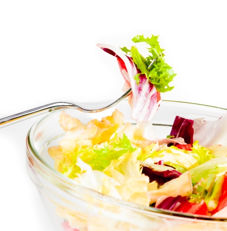 detail of fork on italian fresh salad on white background diet conceptの写真素材