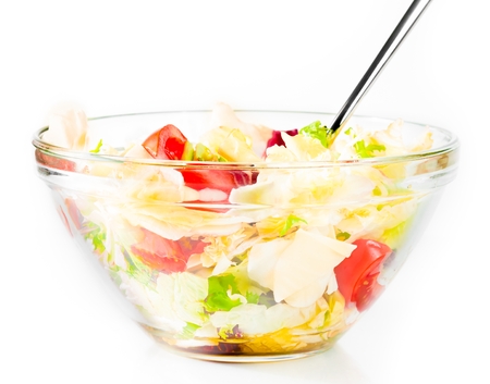 Italian fresh salad with fork isolated on white background diet conceptの写真素材