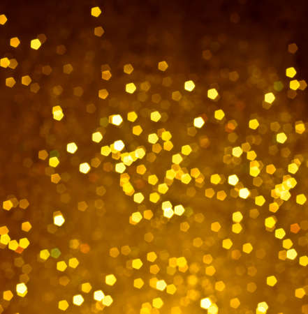 abstract golden bokeh light background, fantasy styleの写真素材